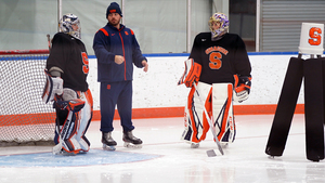 In his first season as Syracuse's goaltenders coach, Nick Harper has led a goalie group which has set multiple program records this season.